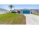 Charming single-story home with well-maintained lawn and bright blue garage door at 3719 Imperial Dr, Winter Haven, FL 33880