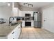 Well-equipped kitchen with stainless steel appliances, granite countertops, and white cabinetry at 3719 Imperial Dr, Winter Haven, FL 33880