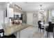 Bright kitchen featuring granite countertops, stainless steel appliances, and a breakfast bar at 3719 Imperial Dr, Winter Haven, FL 33880
