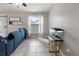 Cozy living room area with tile flooring, a window view, and modern decor at 3719 Imperial Dr, Winter Haven, FL 33880