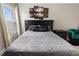 Cozy main bedroom featuring a large bed, side tables, and modern wall art at 3719 Imperial Dr, Winter Haven, FL 33880