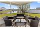 Outdoor seating on the porch with a view of the canal at 3719 Imperial Dr, Winter Haven, FL 33880