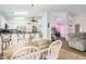 Open-concept dining area with a rustic table and seating for six at 403 Saint Anns Dr, Winter Haven, FL 33884