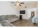 Spacious living room with wood-look floors and comfortable seating at 403 Saint Anns Dr, Winter Haven, FL 33884
