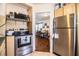 Well-equipped kitchen with stainless steel appliances and an adjacent living and dining area at 424 S Elm Rd, Lakeland, FL 33801