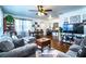 Cozy living room featuring hardwood floors, modern furniture, and large windows at 424 S Elm Rd, Lakeland, FL 33801