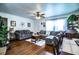 Open living room with hardwood floors, a ceiling fan, and a dining area set up at 424 S Elm Rd, Lakeland, FL 33801