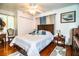 Spacious main bedroom with hardwood floors, a ceiling fan, and a large closet at 424 S Elm Rd, Lakeland, FL 33801
