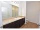 Bathroom featuring a vanity with a sink and a large mirror, complemented by modern lighting at 4932 St James St, Winter Haven, FL 33881