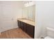 Bright bathroom featuring a modern vanity with a sink and ample cabinet storage at 4932 St James St, Winter Haven, FL 33881