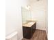 Bathroom featuring a modern vanity with light countertop and sleek dark cabinetry at 4932 St James St, Winter Haven, FL 33881