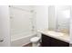 Clean bathroom featuring a tub and shower combination, a single vanity with counter space, and neutral finishes at 4932 St James St, Winter Haven, FL 33881