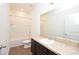 Bright bathroom featuring a shower-tub combo, commode, and vanity with sink, all in a modern style at 4932 St James St, Winter Haven, FL 33881