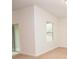 Bright bedroom with carpet flooring, a window, and a sliding glass door at 4932 St James St, Winter Haven, FL 33881