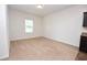 A carpeted bedroom with a window letting in natural light, freshly painted and ready for new occupants at 4932 St James St, Winter Haven, FL 33881