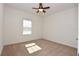 Bedroom featuring neutral carpet, a ceiling fan, and natural light streaming in through the window at 4932 St James St, Winter Haven, FL 33881