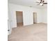 Spacious bedroom with carpeted floors and ceiling fan, with a walk-in closet at 4932 St James St, Winter Haven, FL 33881