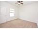 Bedroom with neutral carpet, ample natural light from the window, and a comfortable, inviting atmosphere at 4932 St James St, Winter Haven, FL 33881