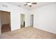Spacious bedroom featuring neutral carpet, ceiling fan, and ensuite bathroom for added comfort and convenience at 4932 St James St, Winter Haven, FL 33881