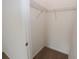 Walk-in closet with wire shelving, offering practical storage solutions and organization in a well-lit space at 4932 St James St, Winter Haven, FL 33881