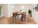 Bright dining room with a modern wood table, seating for six, and natural light at 4932 St James St, Winter Haven, FL 33881