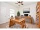 Bright home office with natural light, a functional desk setup, and built-in bookshelves for organization and productivity at 4932 St James St, Winter Haven, FL 33881