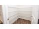 Walk-in pantry with multiple levels of wire shelving and a wood-look floor at 4932 St James St, Winter Haven, FL 33881