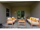 Covered patio features comfortable seating, creating an inviting outdoor living space for relaxation and entertaining at 4932 St James St, Winter Haven, FL 33881