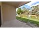 The covered patio with a pond view features a smooth transition to the backyard's serene outdoor space at 4932 St James St, Winter Haven, FL 33881