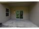 The covered patio with a sliding glass door offers a smooth transition to the backyard's outdoor living space at 4932 St James St, Winter Haven, FL 33881