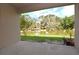 The covered patio with a pond view provides a smooth transition to the backyard's peaceful outdoor space at 4932 St James St, Winter Haven, FL 33881