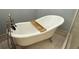 Close up of luxury soaking tub featuring elegant fixtures and hardware at 495 King St, Haines City, FL 33844