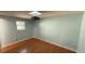 Cozy bedroom with a ceiling fan and natural light from the window at 495 King St, Haines City, FL 33844
