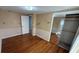 Bedroom with wood floors and a mirrored closet, ready to customize at 495 King St, Haines City, FL 33844