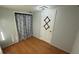 Small bedroom featuring a closet with decorative curtain rod and new flooring at 495 King St, Haines City, FL 33844