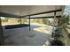 Covered parking carport with a driveway and garden at 495 King St, Haines City, FL 33844