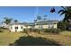 Charming home with a bay window, solar panels and well-maintained landscaping enhancing the curb appeal at 495 King St, Haines City, FL 33844