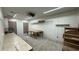 Spacious garage interior with built-in shelves, ample workspace, and overhead lighting for projects at 495 King St, Haines City, FL 33844