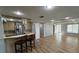 Modern kitchen with stainless steel appliances and a breakfast bar at 495 King St, Haines City, FL 33844