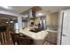 Eat-in kitchen featuring stainless steel appliances, ample cabinet space, and counter seating at 495 King St, Haines City, FL 33844