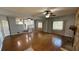 Spacious living room featuring hardwood floors, natural lighting, and a cozy fireplace at 495 King St, Haines City, FL 33844