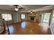 Spacious living room featuring hardwood floors, natural lighting, and a cozy fireplace at 495 King St, Haines City, FL 33844