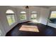 Bright sunroom with multiple windows, wood paneling, and lots of natural light at 495 King St, Haines City, FL 33844