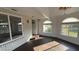 Bright sunroom featuring brick accent wall, multiple windows, and lots of natural light at 495 King St, Haines City, FL 33844