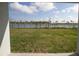A view of the backyard and lake at 5062 Foxglove Cir, Lakeland, FL 33811