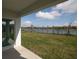A view of the backyard and lake from the rear patio at 5062 Foxglove Cir, Lakeland, FL 33811