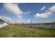 A spacious fenced backyard with a serene lake view at 5062 Foxglove Cir, Lakeland, FL 33811