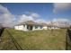 Back exterior of home featuring an outdoor patio and spacious backyard at 5062 Foxglove Cir, Lakeland, FL 33811