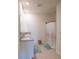 Well-lit bathroom boasts a double sink vanity and a shower with patterned curtain at 5062 Foxglove Cir, Lakeland, FL 33811