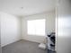 Empty bedroom filled with natural light and featuring plush gray carpeting at 5062 Foxglove Cir, Lakeland, FL 33811